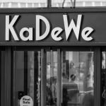 Kadewe department store entrance in black and white.