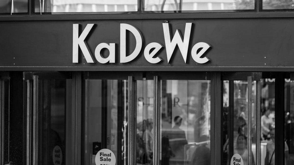 Kadewe department store entrance in black and white.